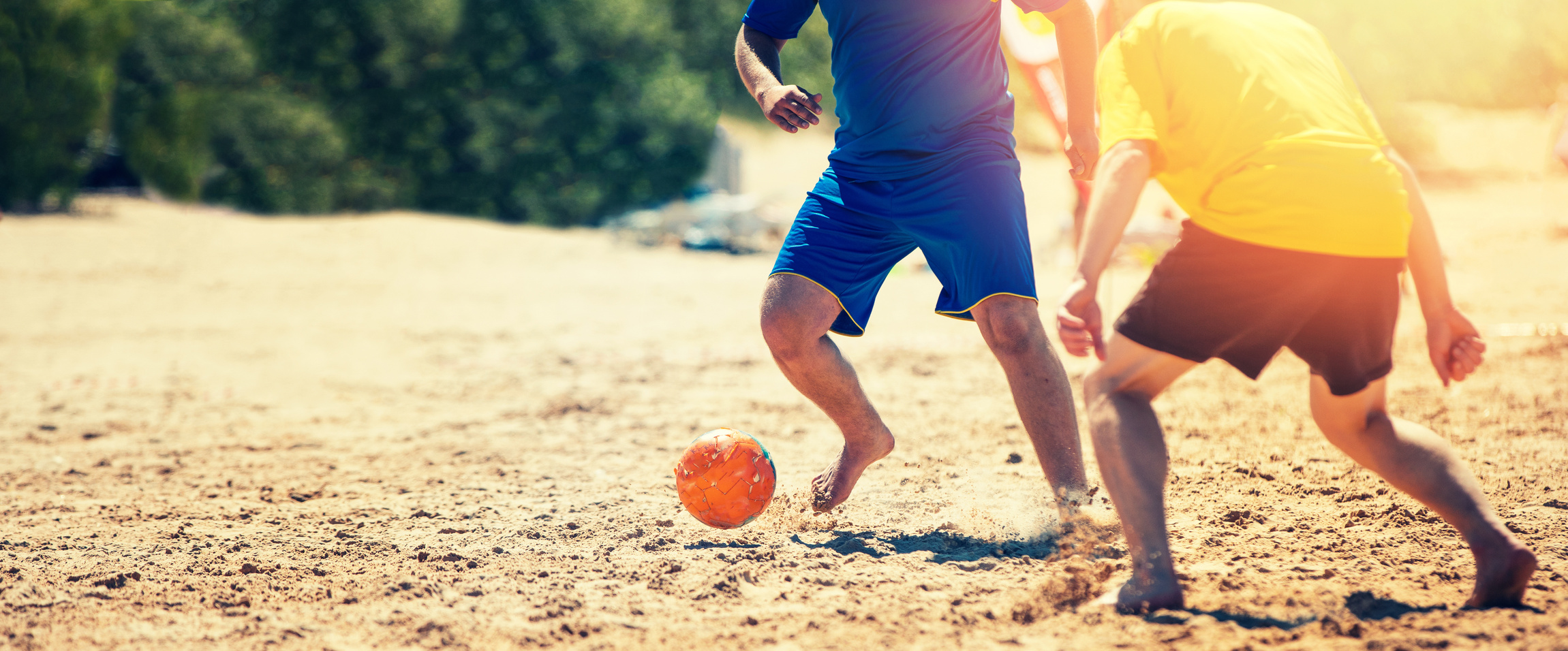 playing beach soccer